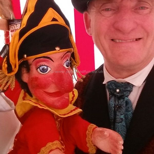 Prof Ron Wood holding Mr Punch at Brodsworth Hall, West Yorkshire