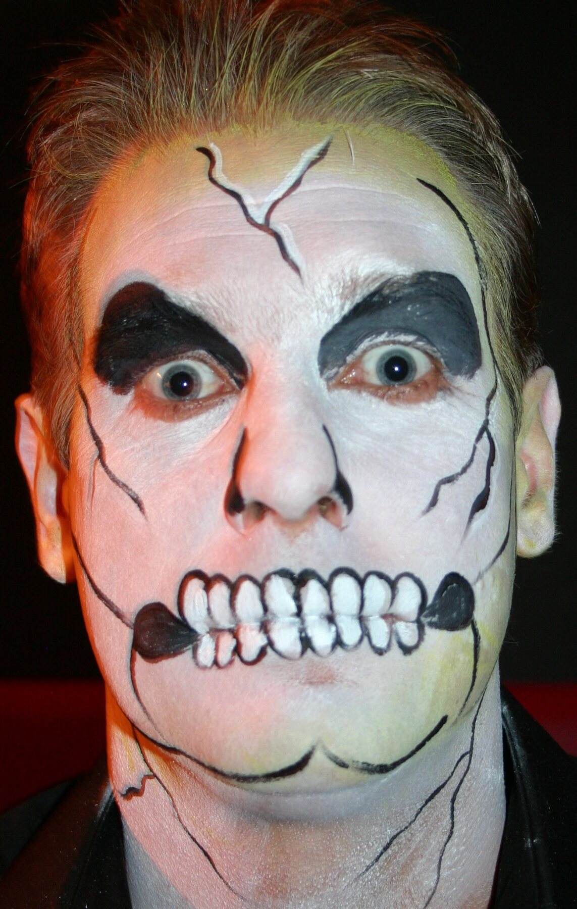 Skull adult face-painting design by Hazel Wood