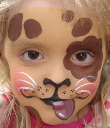 Playful puppy face-painting design by Hazel Wood