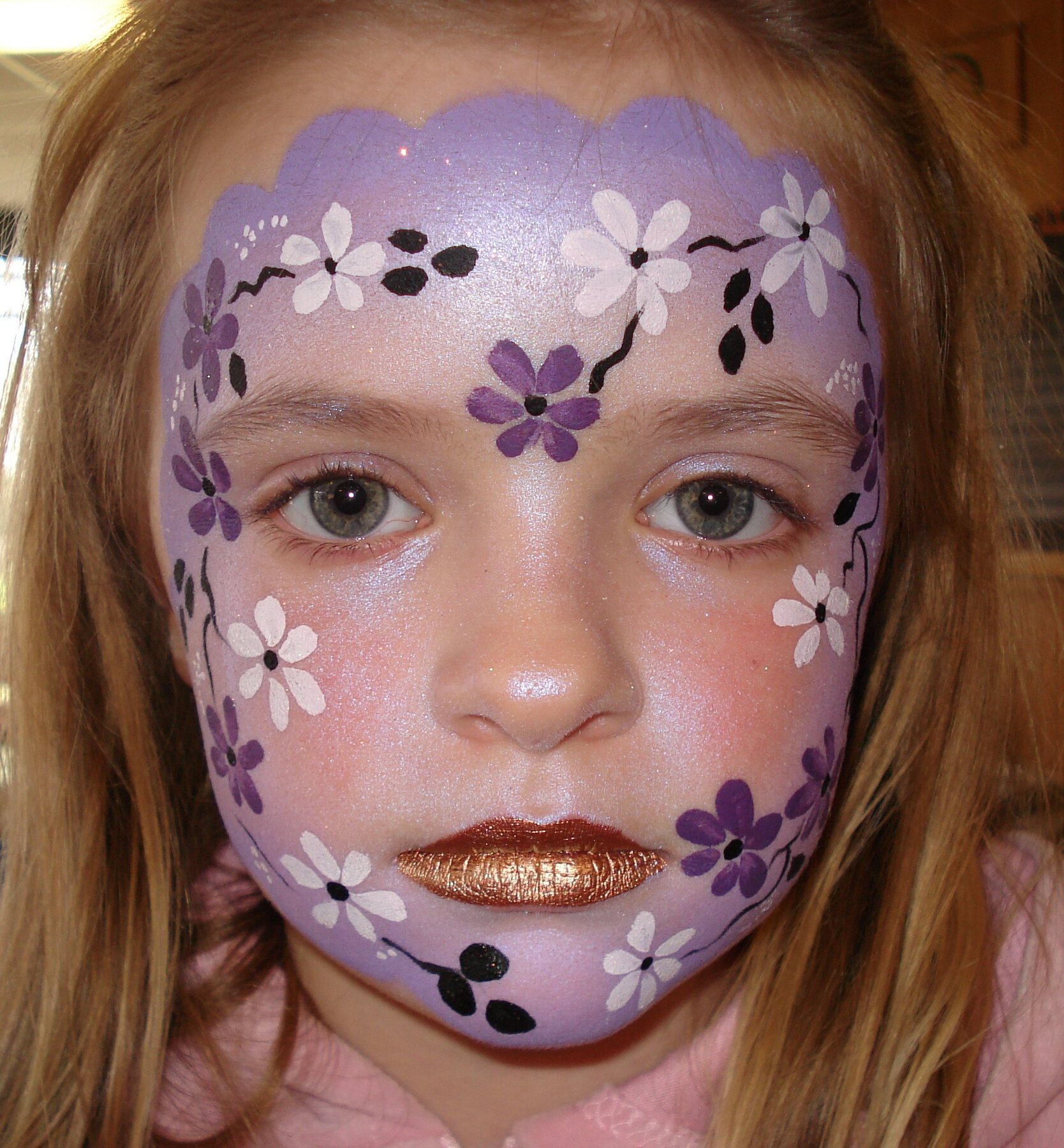 Lilac flower face-painting design by Hazel Wood