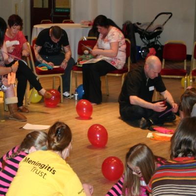 Children and adults taking part in a craft workshop
