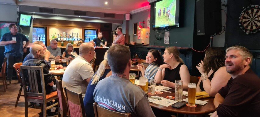 Race night guests following the action