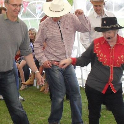 Line dancing at a Jolly Good Productions event