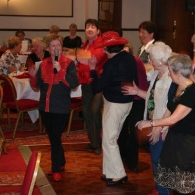 Line dancing at a Jolly Good Productions event