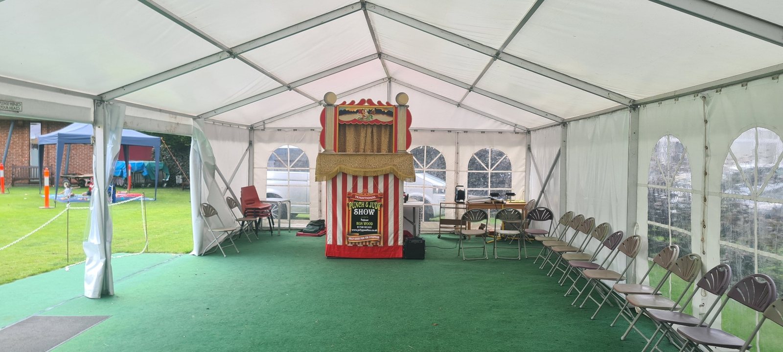 Punch and Judy theatre set up inside the Burnby Hall Gardens entertainment marquee