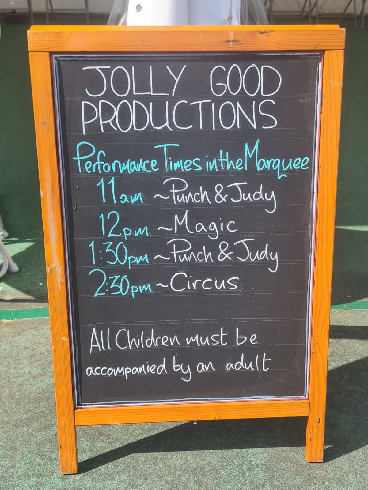 Programme board listing Punch and Judy, magic and circus performances at Burnby Hall Gardens