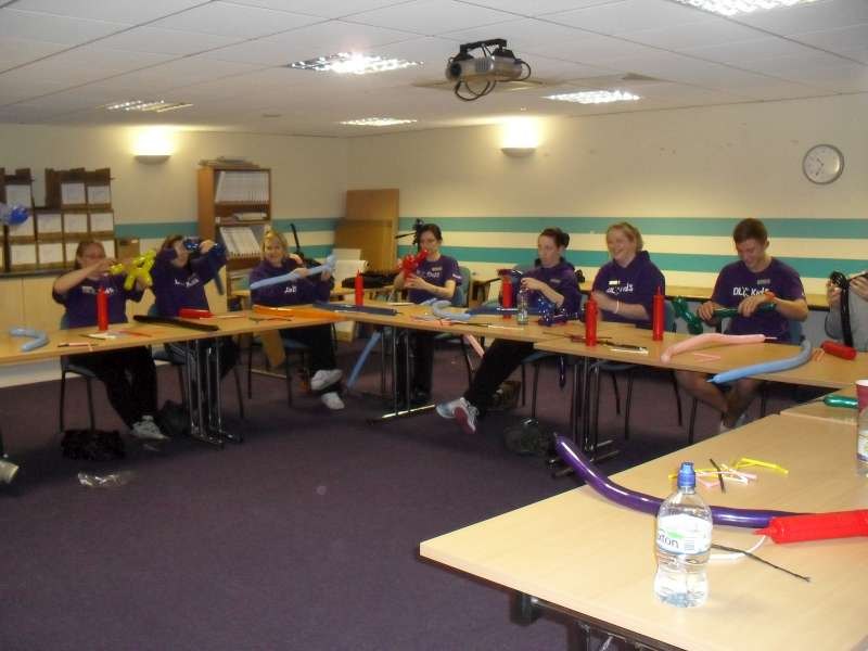 David Lloyd staff seated around the room during balloon modelling training