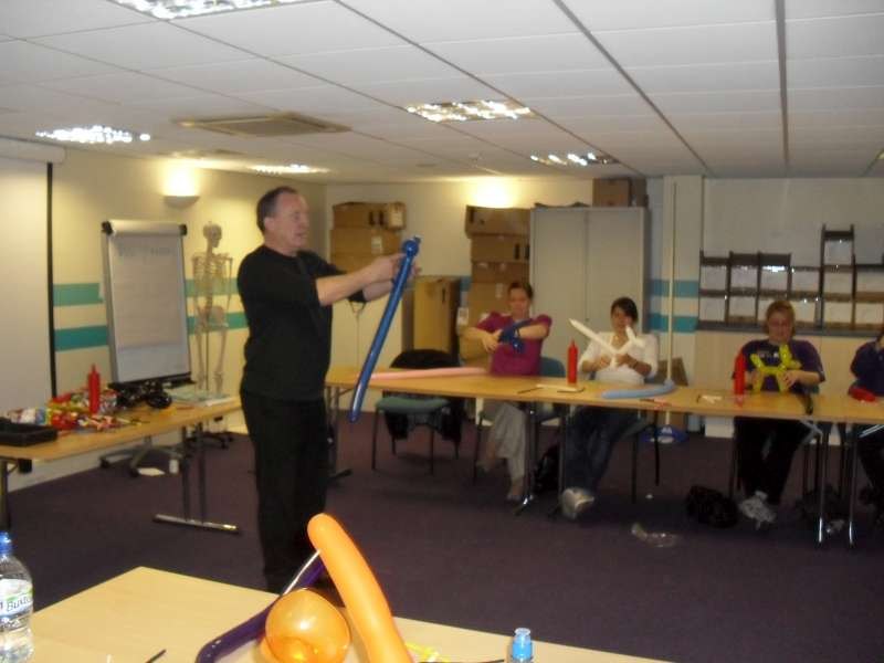Ron Wood demonstrating balloon modelling to David Lloyd staff