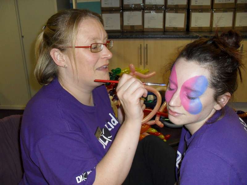 A trainee practising face painting during the David Lloyd course