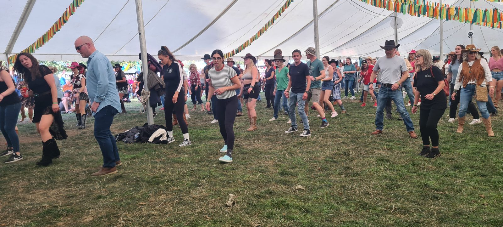 Festival visitors line dancing together at Dubs int Dales