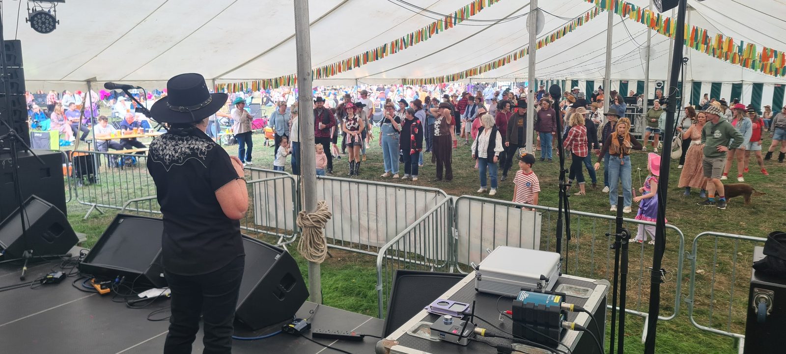 Hazel Wood leading line dancing from the stage at Dubs int Dales