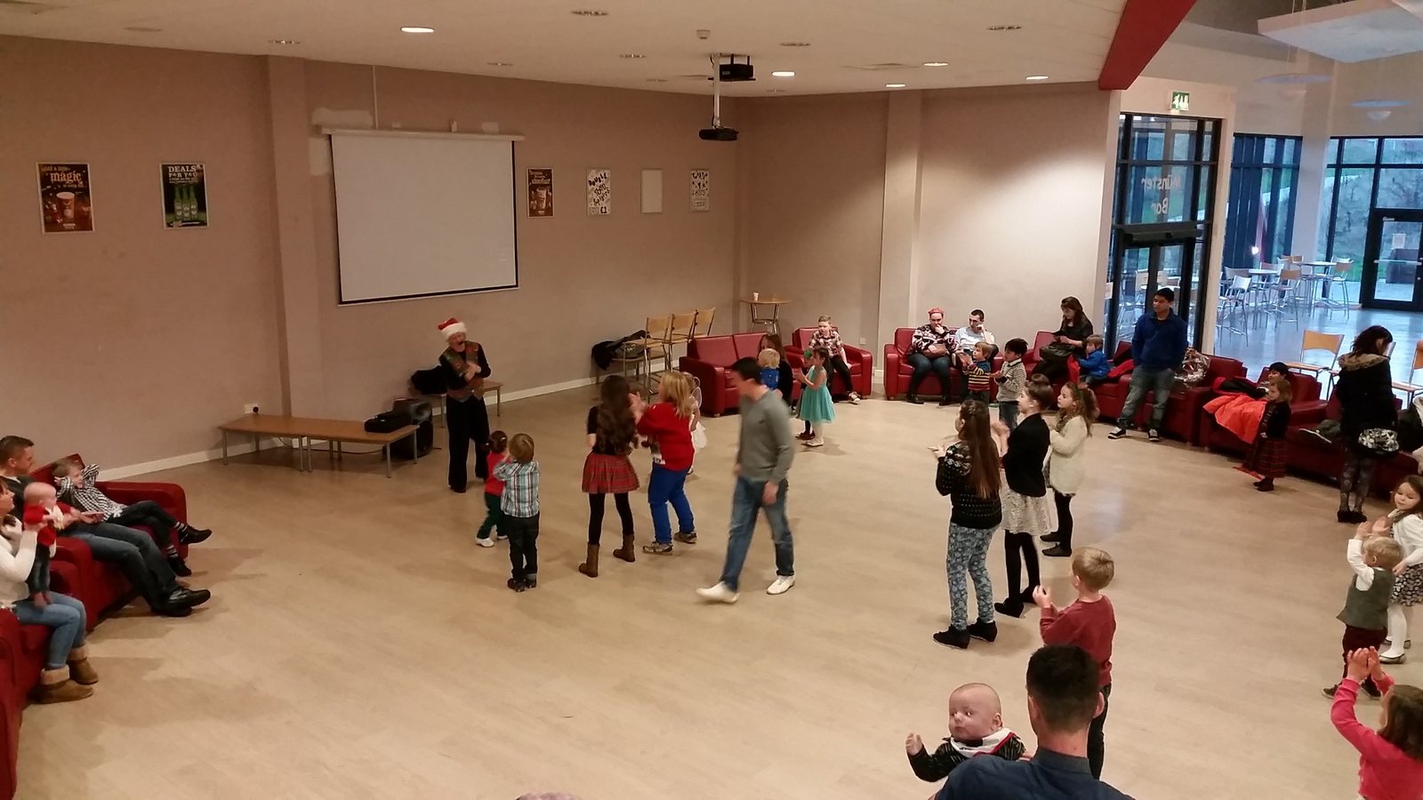 Children joining a Christmas conga led by Hazel Wood