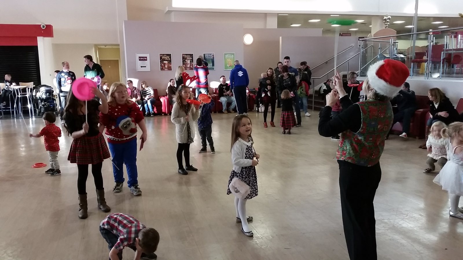 Children enjoying Christmas entertainment at an Army family party