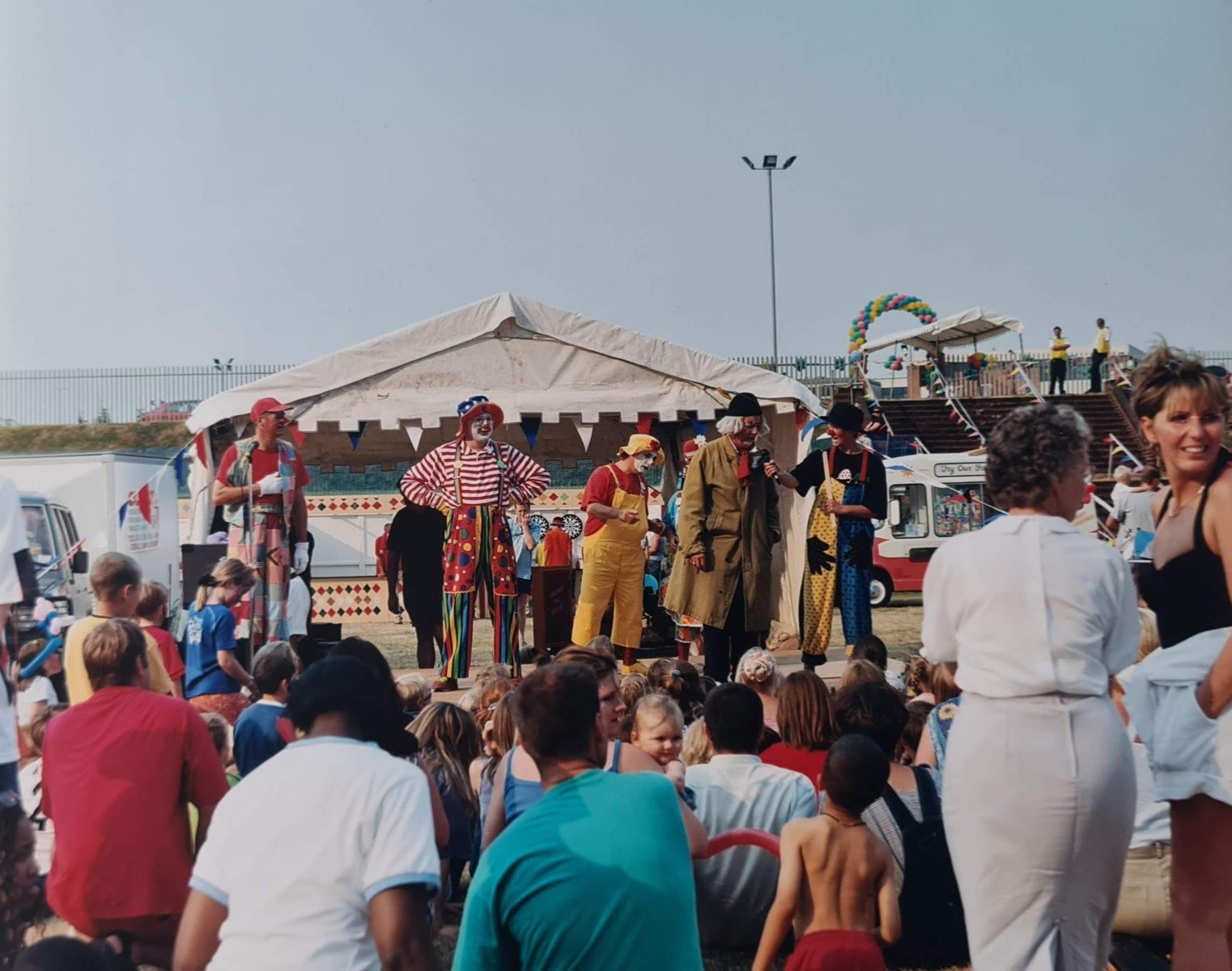 Clowns entertaining a large family audience at the GE Capital event