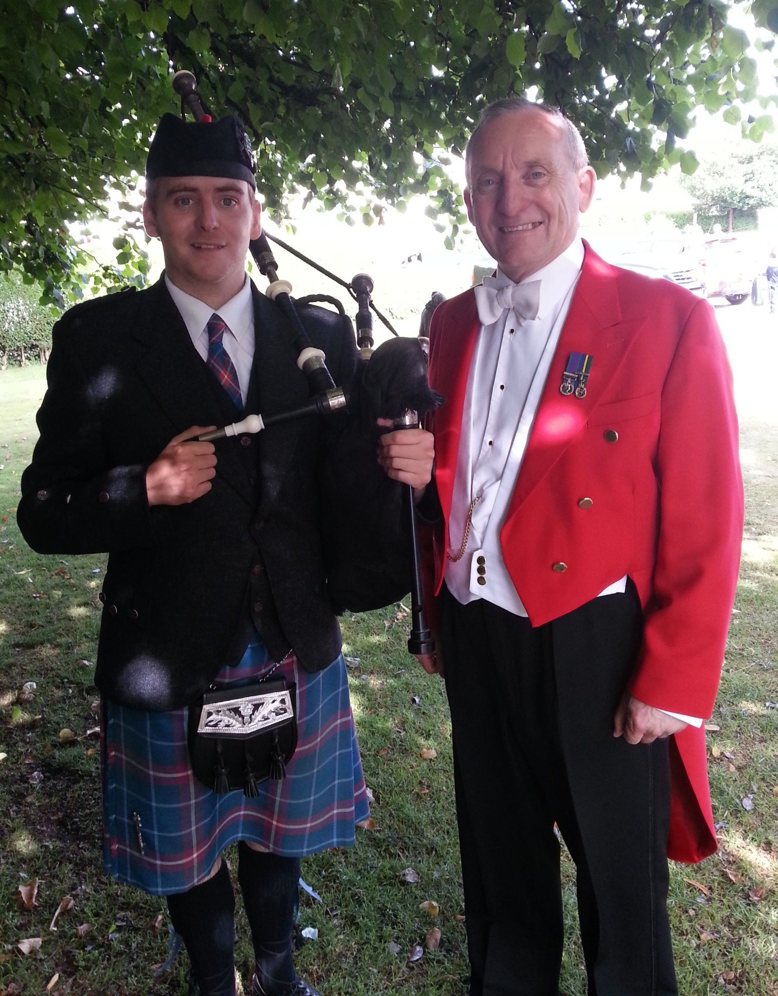 Ron Wood in traditional Toastmaster dress beside the wedding horses at Gretna Green