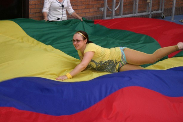 Hen-party guests laughing during parachute games