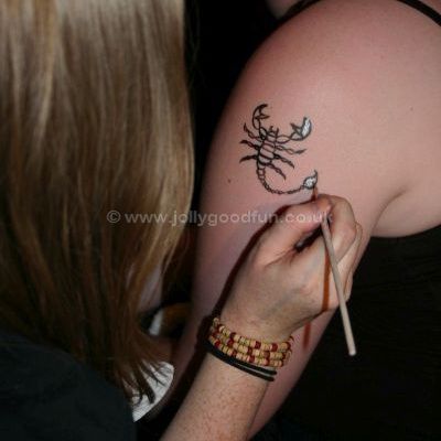 Temporary tattoo scorpion on arm